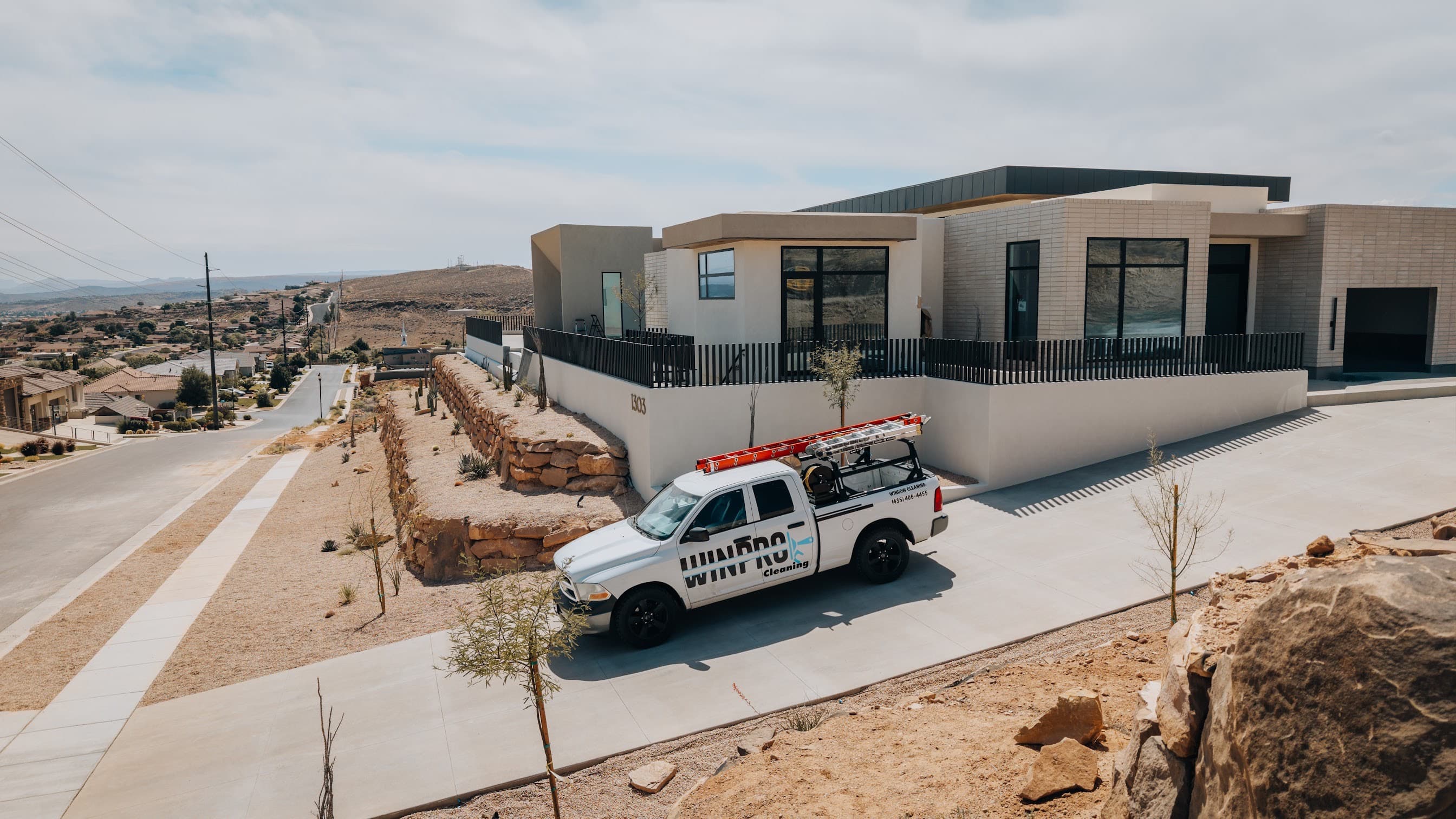 Another drone shot of branded truck and home